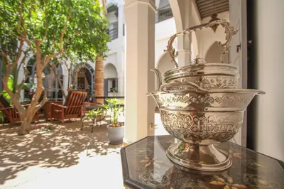 a metal vase sitting on top of a table at Riad 64 Maison D'hôtes & Spa in Marrakech