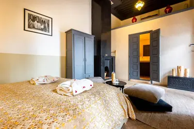 a bedroom with a large bed with pillows on it at Riad 64 Maison D'hôtes & Spa in Marrakech