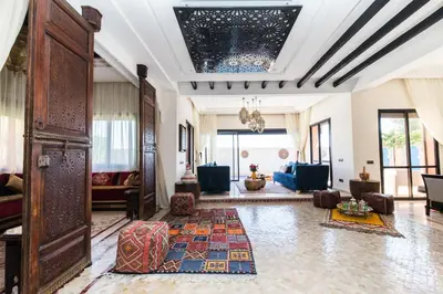 a living room with a lobby with a chandelier at VILLA ILYANA in Marrakech
