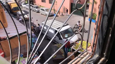 a view of a street with a car parked on the street at Dar Soraya al Madina Marrakech in Marrakech