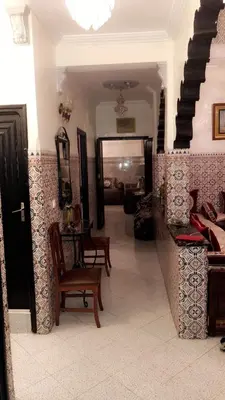 a living room with a couch and a chair at Dar Soraya al Madina Marrakech in Marrakech