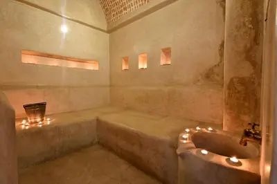 a bathroom with a tub and a sink at Riad les Ammonites and Spa in Marrakech