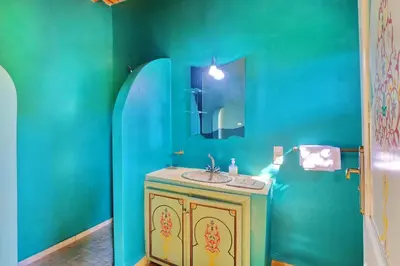 a bathroom with a sink and a blue wall at Hacienda Marrakech in Marrakech