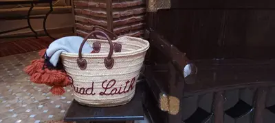 a basket sitting on top of a wooden bench at Riad Laith in Marrakech