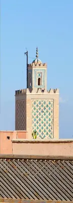 a clock tower on top of a building at Riad Dar Housnia in Marrakech