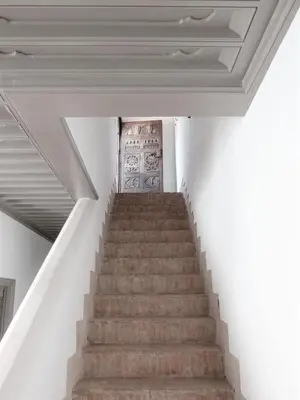 a staircase in a building with a white ceiling at Riad Louhou in Marrakech