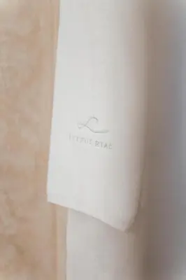 a white book with a hanger on it at Riad Louhou in Marrakech