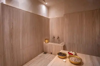 a bathroom with two bowls on a wooden table at Riad & Spa Azzouz in Marrakech