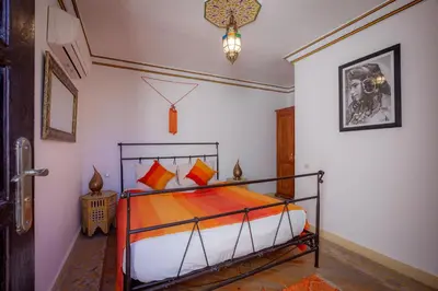 a bedroom with a bed in a room at Dar Halima in Marrakech