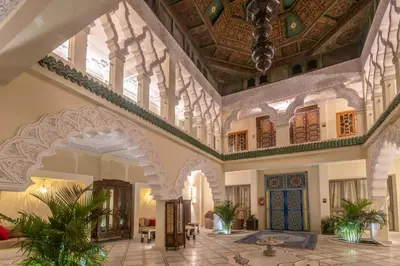 a lobby of a building with a large ceiling at Palais Dar Si Aissa ALL-SUITES in Marrakech