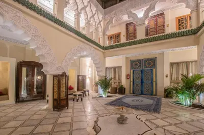 an ornate lobby with a large room with doors and ceilings at Palais Dar Si Aissa ALL-SUITES in Marrakech