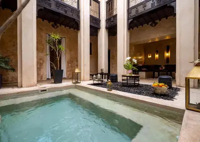 a large swimming pool in the middle of a building at Riad Vanilla Sma & Spa in Marrakech