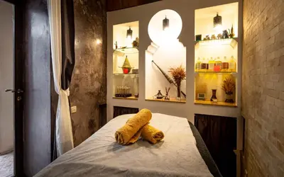 two towels sitting on a bed in a room at Riad Vanilla Sma & Spa in Marrakech