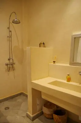 a bathroom with a sink and a shower at Riad Kasbah 117 in Marrakech