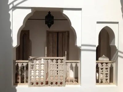 a white building with a gate and a door at Riad Safa in Marrakech