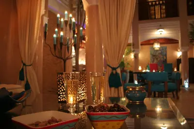 a table with a bowl of food on top of it at Riad Turquoise in Marrakech