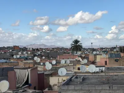 a city with satellites on the roofs of buildings at Riad Medina in Marrakech