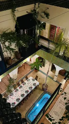 an overhead view of a room with a table and a pool at Riad Dalla Santa in Marrakech