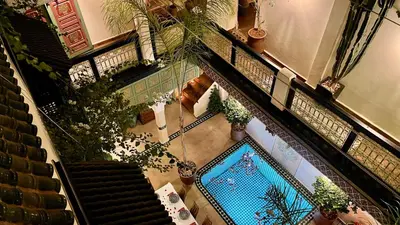 an overhead view of a building with a swimming pool at Riad Dalla Santa in Marrakech