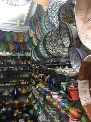 a display of pottery on display in a store at Riad Le Marrakech Berrima in Marrakech