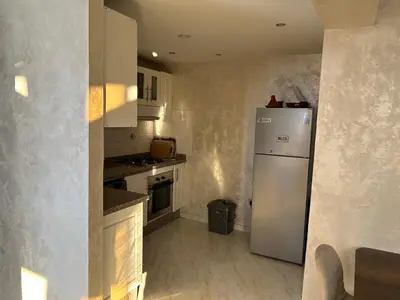 a kitchen with a white refrigerator in a room at Susana home in Marrakech