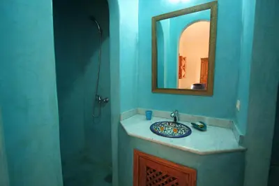 a bathroom with a sink and a mirror at Riad Morgane in Marrakech