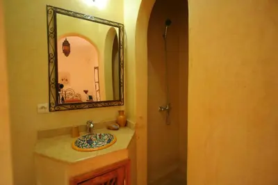 a bathroom with a sink and a mirror at Riad Morgane in Marrakech