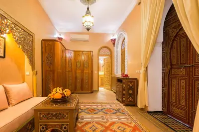 a room with a couch and a table with bananas on it at Riad Tahyra in Marrakech