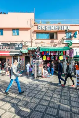 a group of people walking down a street at BnB MEDINA in Marrakech