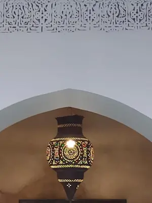 a chandelier hanging from a ceiling in a building at Riad Les Nuits de Marrakech in Marrakech