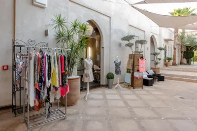 a store with clothes on racks in a building at Residence Dar Lamia Marrakech in Dar Caïd Layadi