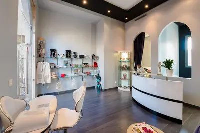 a dressing room with white chairs and shelves at Residence Dar Lamia Marrakech in Dar Caïd Layadi