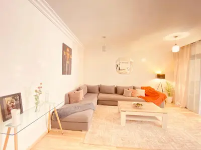 a living room with a couch and a table at Cosy stays central apartements , guéliz Marrakech in Marrakech