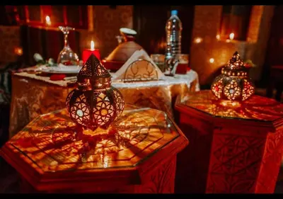a room with two tables with lights on them at Riad dar Assou in Marrakech