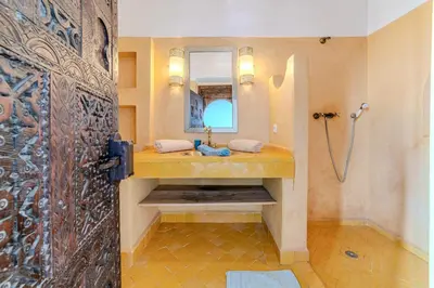 a bathroom with a sink and a mirror at Riad Ayla avec Piscine Privée in Marrakech