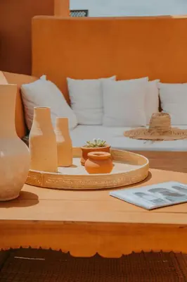 a table with two beds with white pillows at Dar El Qadi in Marrakech
