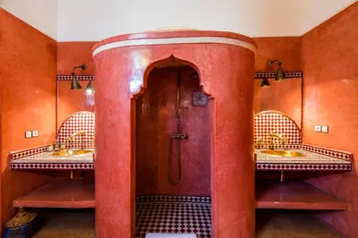 a bathroom with two sinks and a shower at Riad dar Ourika & SPA in Marrakech