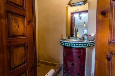 a bathroom with a sink and a mirror at Riad dar Ourika & SPA in Marrakech