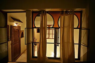 an open door with curtains in a room at Riad la Cigale in Marrakech