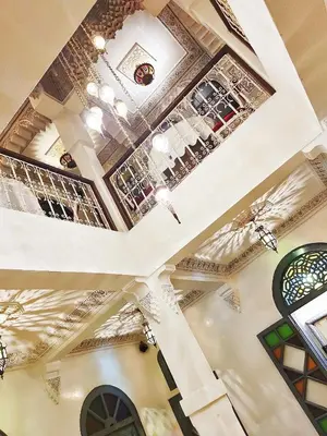 a coffered ceiling in a building with stained glass windows at Riad Kech Soul Boutique & Spa in Marrakech