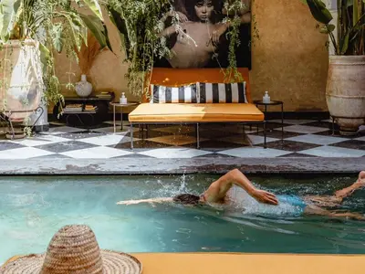 two people swimming in a swimming pool at Sakkan in Marrakech