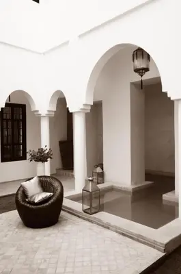 a living room with a chair in the middle at Maison Manzano in Marrakech