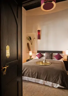 a bedroom with a bed with a sink in it at Maison Manzano in Marrakech