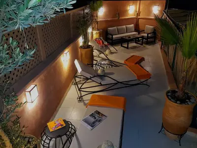 an overhead view of a living room with plants at Riad BILKIS in Marrakech