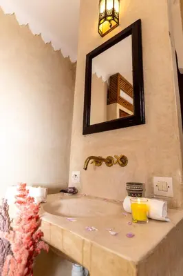 a bathroom with a sink and a mirror at Riad Shambala in Marrakech