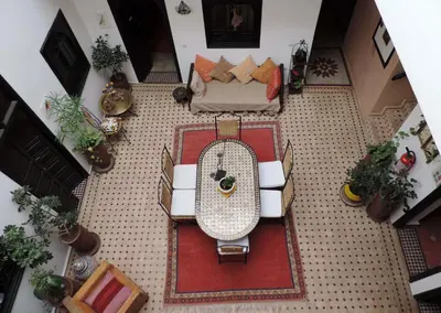 an overhead view of a living room with a table and a couch at Riad Dar Zampa in Marrakech