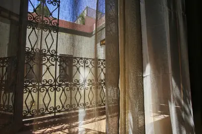 an open door with a window with curtains at Riad du Ciel Marrakech in Marrakech