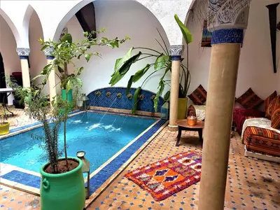 a house with a swimming pool in a room at Riad Rêve d Antan in Marrakech