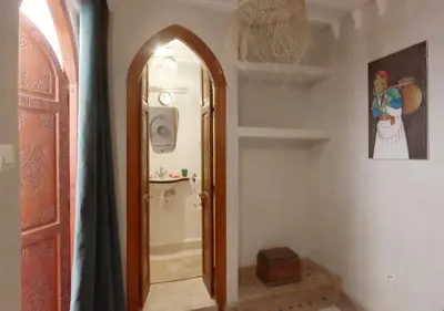 a hallway with an archway in a room at Riad Venezia in Marrakech