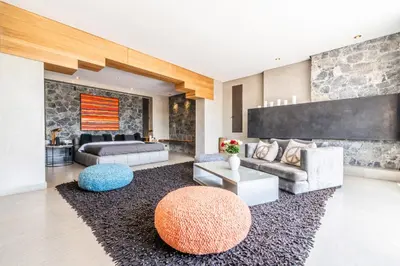 a living room with a couch and a table at Zagora and Marhba villas Marrakech - by EMERALD STAY in Marrakech
